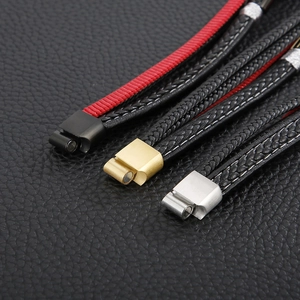 Detailed close-up of woven multi-layer leather bracelets with magnetic steel clasps