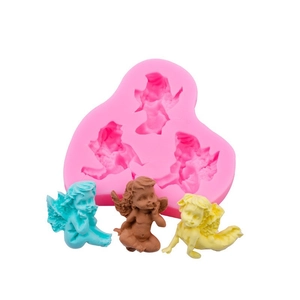 Pink silicone heart mold with three angel cavities and colorful plaster samples