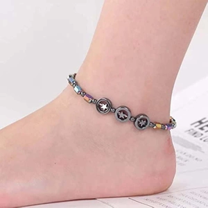Rainbow beaded magnetic hematite anklet featuring star pattern charms on female ankle