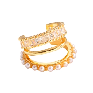 Detailed view of layered gold ear cuff with rectangular zircons and tiny white pearls