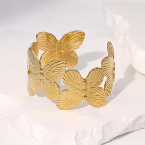 Vintage gold plated stainless steel open bangle with hollow butterfly filigree design