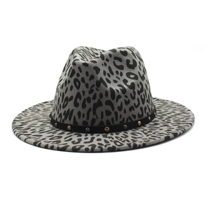 Detail view of grey leopard print fedora hat with black studded band and wide brim