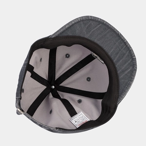 Inside view of grey washed cotton baseball cap with adjustable metal buckle and inner lining