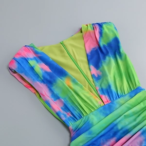 Detailed view of the V-neckline with a hidden zipper on a colorful tie-dye summer dress
