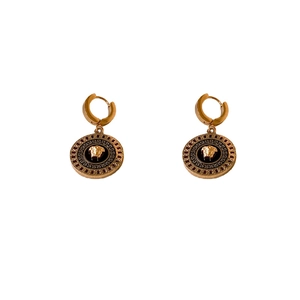 Golden Medusa head earrings with Greek key pattern border on black circular pendant