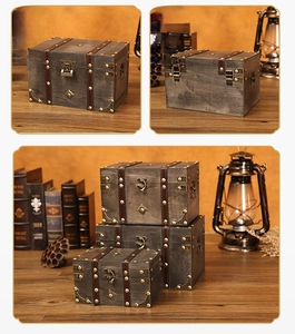 Macro detail of vintage grey wood storage boxes with leather straps and metal buckles