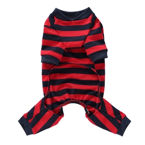 Detail of red and black striped dog pajamas showing ribbed cuffs and soft cotton texture