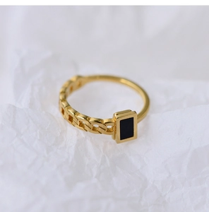 Detail of 18K gold plated chain ring featuring a minimalist black rectangular inlay