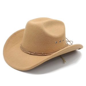 Detail of camel wool felt western cowboy hat with leather band and metal ventilation eyelets
