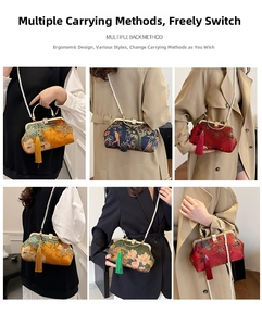 Detail of embroidered silk handbag showing versatile carrying styles and pearl chain strap