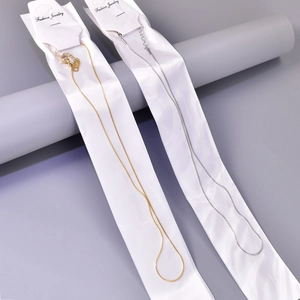 Detail of 18K rose gold snake chain necklace with lobster clasp and K18 hallmark
