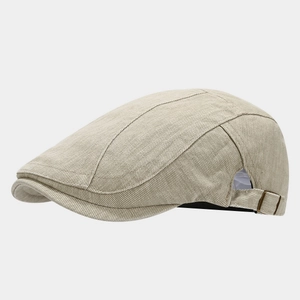 Detail view of the vintage washed cotton beret with antique bronze metal buckle