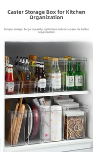 Detail view of transparent kitchen storage box with bottom rollers for deep cabinet access