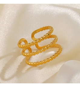 Detailed view of triple-layered gold stainless steel ring with beaded texture and open band