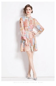 Detail of vintage geometric print dress with stand collar and matching waist belt