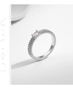 Detail of s925 silver double layer ring with marquise cut stone and zircon pavé
