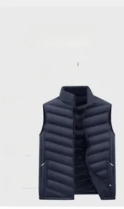 Close-up of a men's navy blue quilted vest with stand collar and zipper pockets