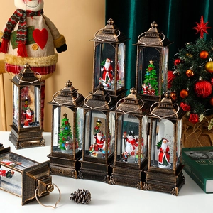 Vintage bronze Christmas lantern music box with Santa Claus and swirling glitter snow