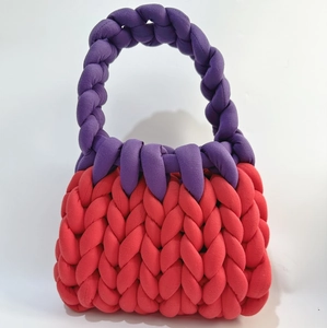 Chunky handmade knit handbag in vibrant red and purple contrasting woven cotton yarn