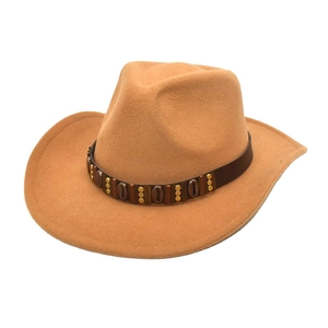 Detail of camel wool fedora hat featuring brown leather band with metallic vintage buckles