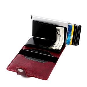 Macro view of burgundy leather RFID blocking wallet with ejected cards and money clip
