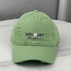 Distressed light green baseball cap with Malinsky embroidery and wide brim