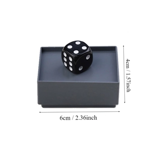 Detailed view of dice magic prop showing 4cm and 6cm dimensions with a black die