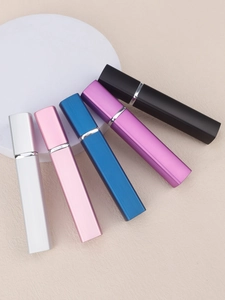 Detailed view of 12ml aluminum travel perfume atomizers with metallic striped texture