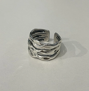 Close-up of S925 sterling silver ring featuring a vintage layered lava texture and adjustable band