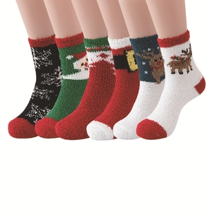 Detailed view of six coral fleece Christmas socks with festive reindeer and Santa patterns