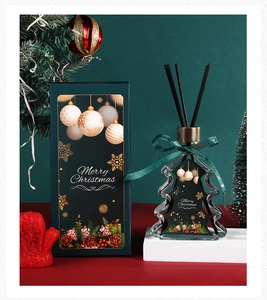 Christmas tree reed diffuser gift set with green ribbon and festive gift box packaging
