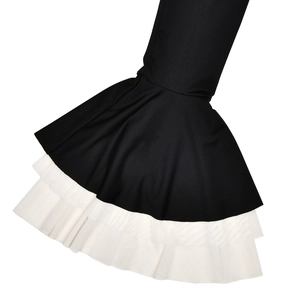 Detailed close-up of slim-fit black sleeves with elegant double-layered white mesh ruffles