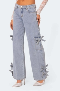 Detailed side view of light blue denim cargo pants featuring unique bow tied pockets