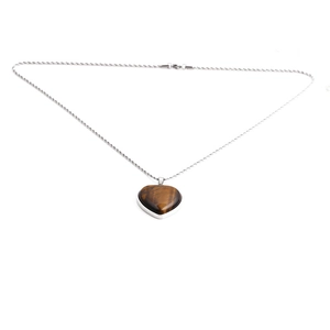 Tiger eye heart pendant necklace with silver twisted chain on white background