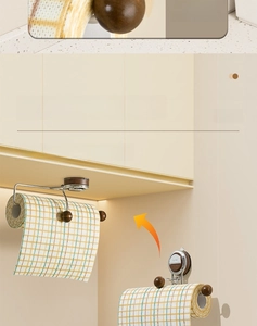 Detail showing wall-mounted paper towel holder with wooden finish and magnetic suction base