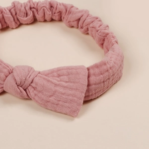 Elastic cotton baby headband with bow knot in dusty pink for newborns and infants
