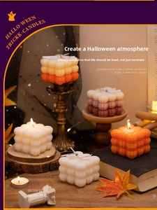 Detail of pumpkin bubble cube candle with safe smoke-free wax for Halloween decor