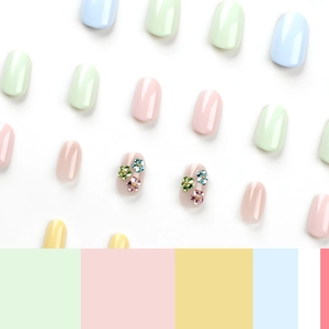 Short round macaron press-on nails set with 3D floral gemstone designs for Easter
