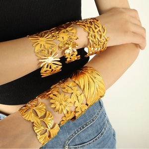 Golden titanium steel upper arm cuffs featuring hollow butterfly and leaf designs