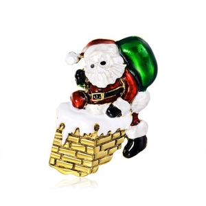 Detail of enamel Santa Claus climbing a gold chimney brooch with white snow accents