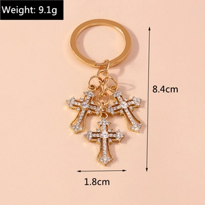Golden rhinestone cross keychain with three pendants for bags and key accessories