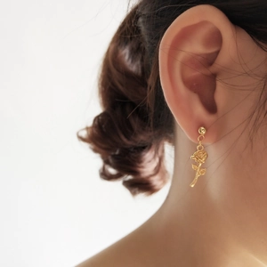Elegant 925 sterling silver gold rose flower stud earrings on female model