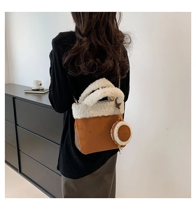 Detail of caramel suede bucket bag with white faux shearling trim and round coin purse