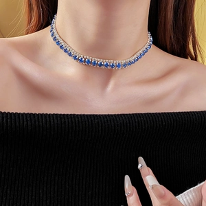 Macro view of blue double-row rhinestone choker necklace on a female model neck