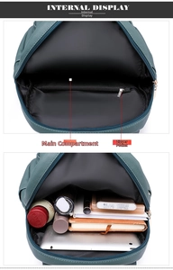 Detail view of leather backpack interior compartments showing storage capacity for tablets