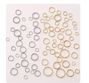Macro shot of assorted gold and silver stainless steel open jump rings for DIY jewelry