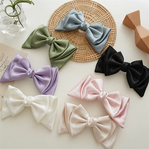 Elegant satin bow hair clips in assorted pastel colors for girls and women hair styling