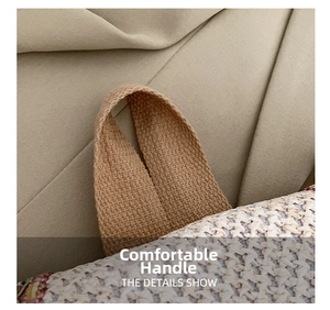 Close-up of the textured woven handle and detailed straw stitching on the bucket bag