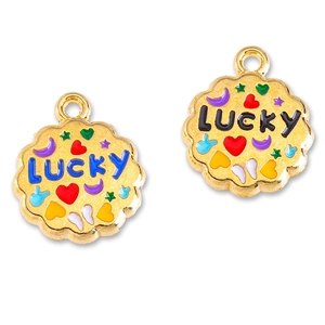 Detailed macro of golden Lucky charms with colorful enamel heart, star and moon symbols