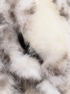 Macro view of plush faux fur texture with soft beige and taupe long-haired fibers